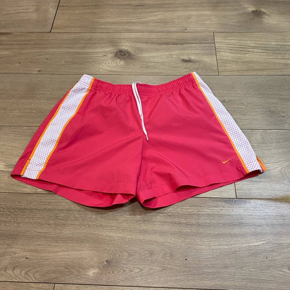 Pink Nike track shorts